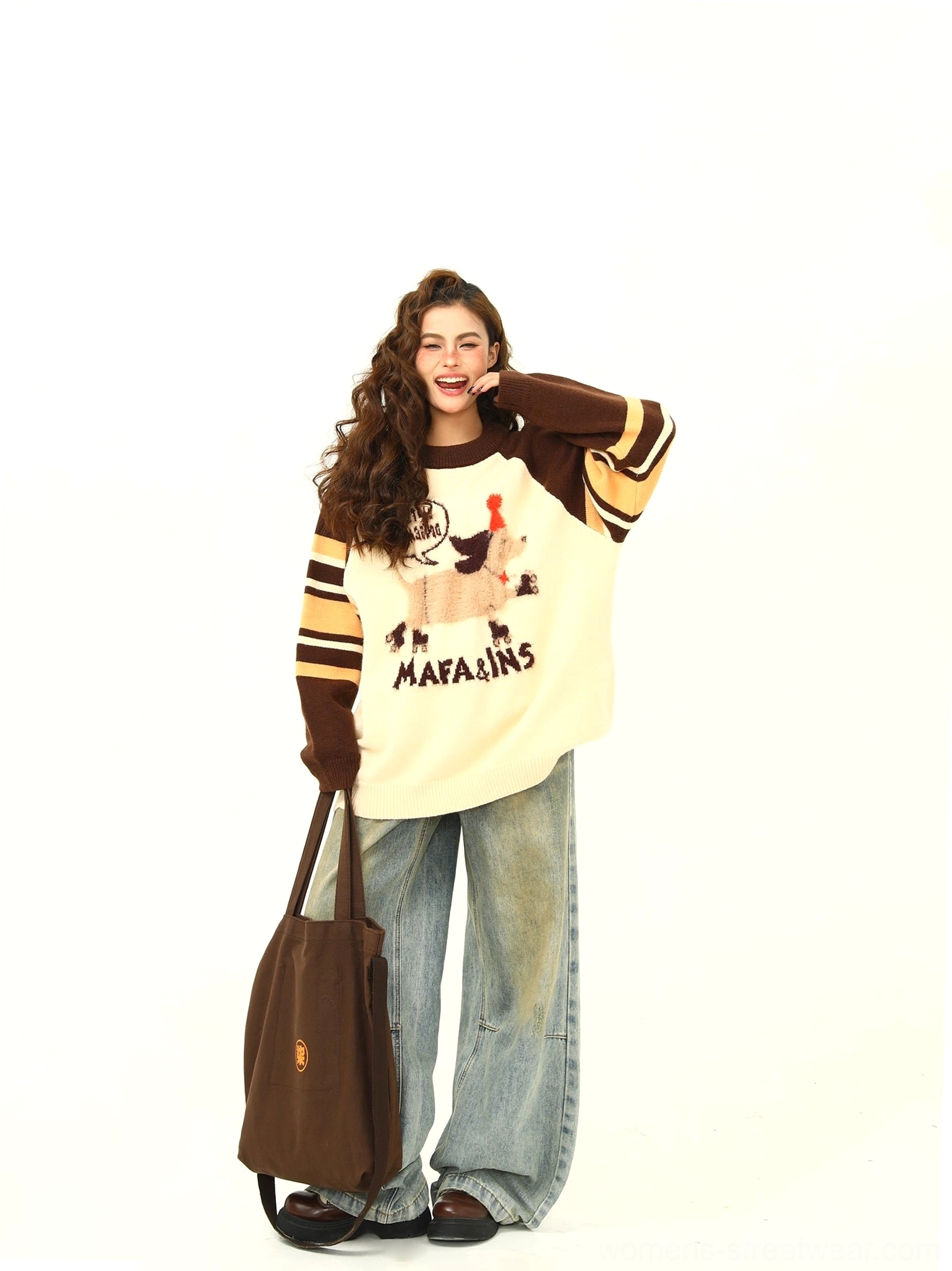 Cute cartoon dachshund knit sweater with cream body and brown yellow striped sleeves styled with wide-leg jeans and tote bag