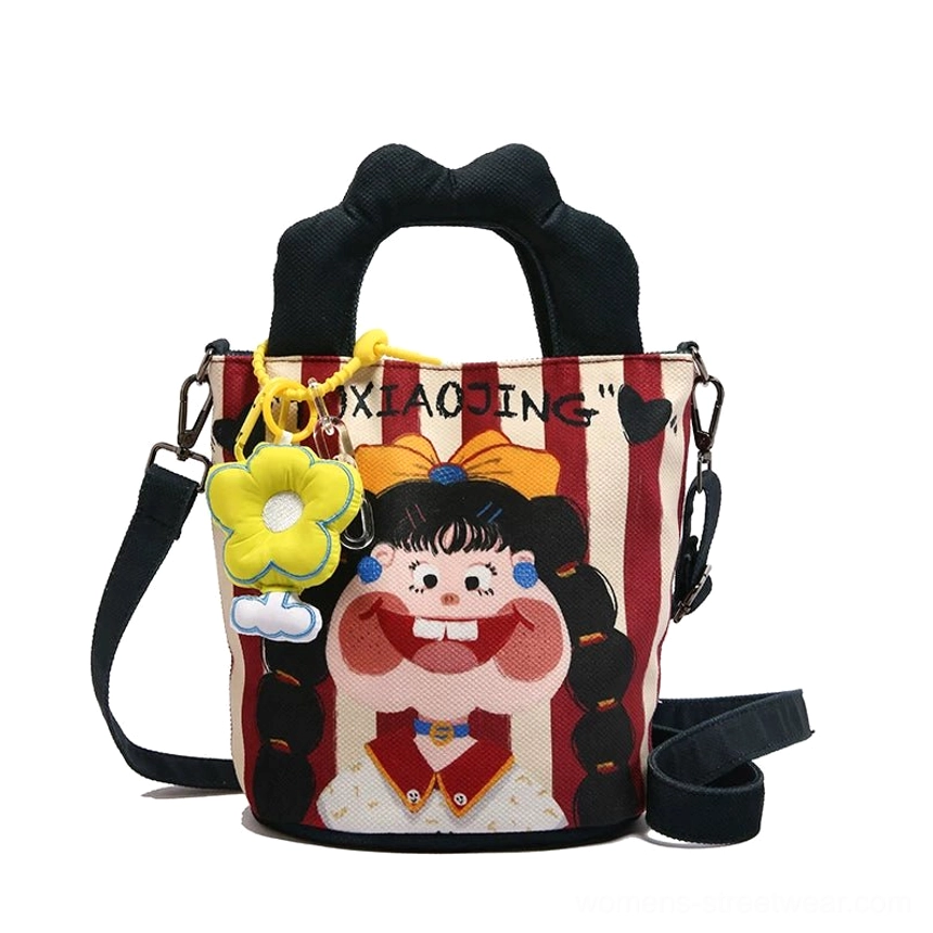Back view and strap detail of cartoon canvas tote showing construction quality and professional finishing streetwear piece