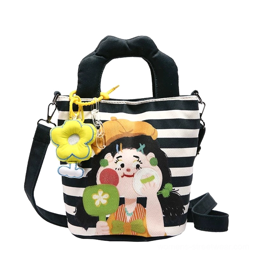 Green and blue cartoon tote styled with casual streetwear outfit showing Y2K aesthetic and everyday carry functionality