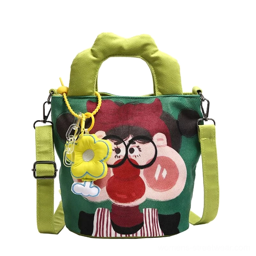 Cartoon canvas tote bag hand-held carry demonstration showing handle rise and padded grip design for comfortable daily use