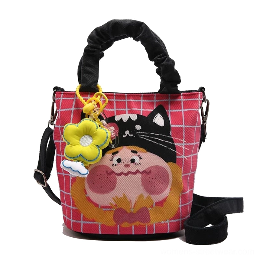 Interior compartment organization of cartoon canvas tote showing magnetic snap closure and accessible daily carrying space
