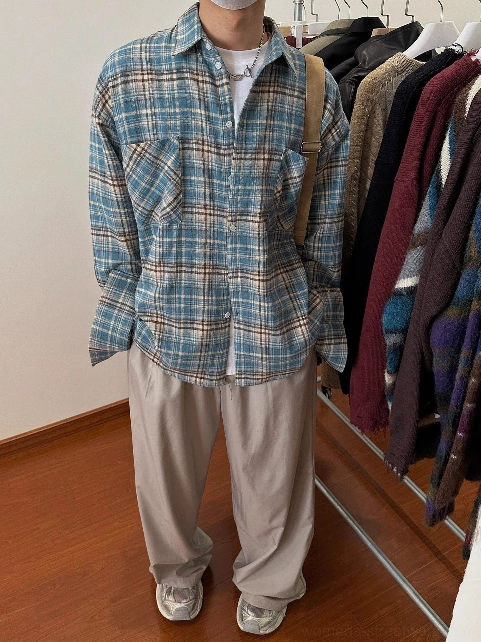 Casual oversized tartan flannel shirt designed for layering with modern Seoul street fashion outfits
