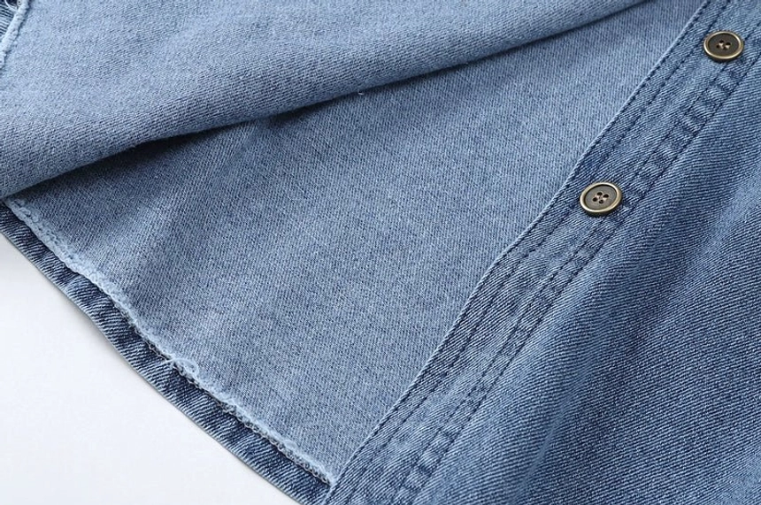 Casual washed denim shirt jacket for women in a faded blue finish, suitable for Y2K outfits and modern streetwear styling