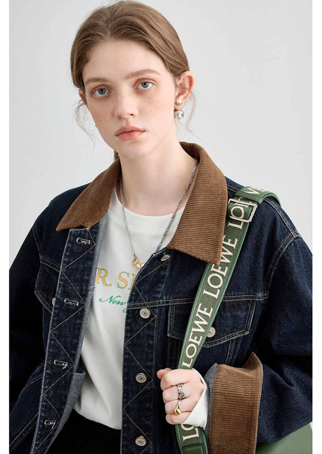 Casual women’s denim jacket featuring a relaxed fit, contrast seams, button front, and dual chest pockets