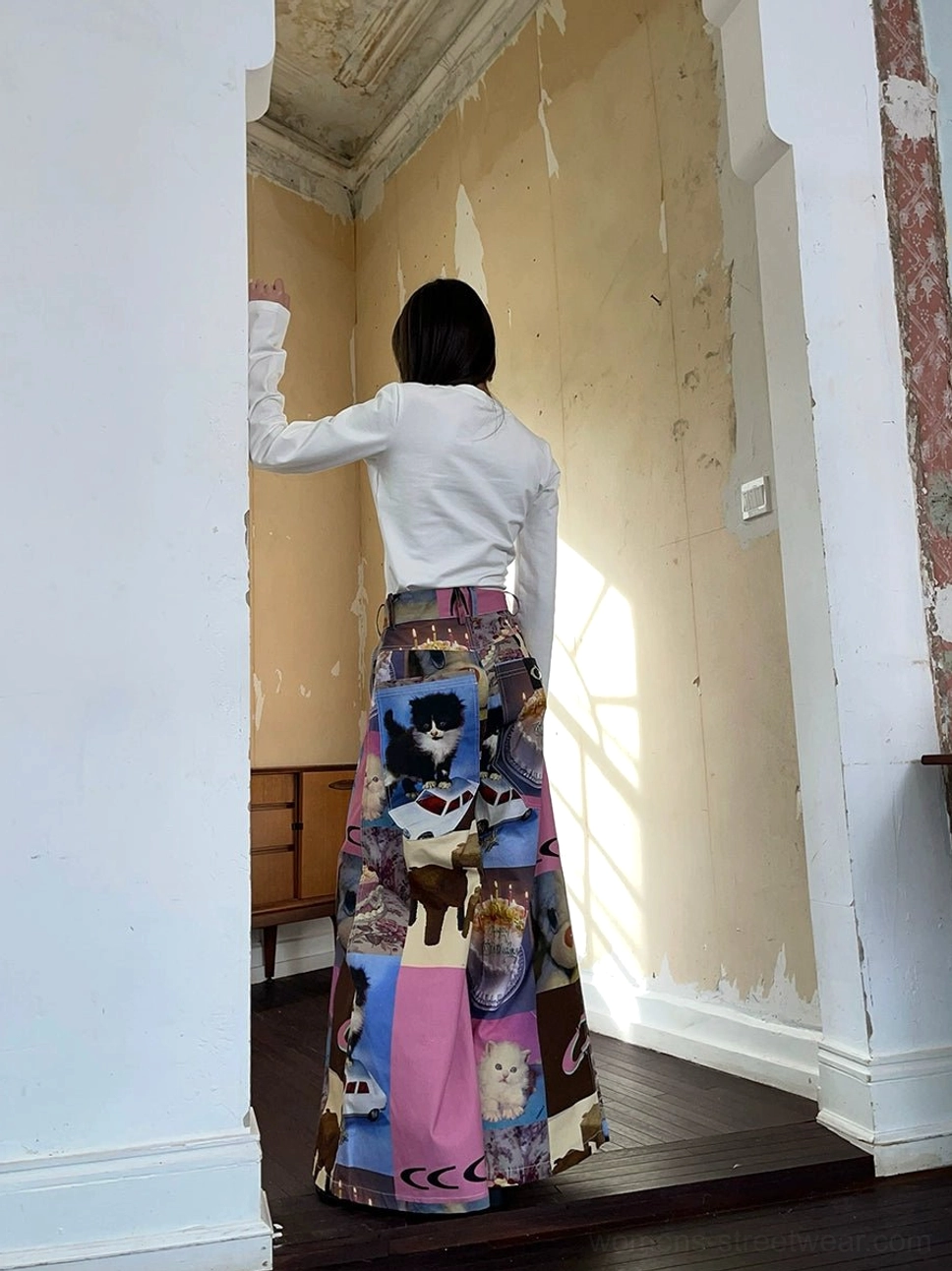 Back side view of colorful cat cake patchwork print wide-leg pants with high-waist streetwear silhouette