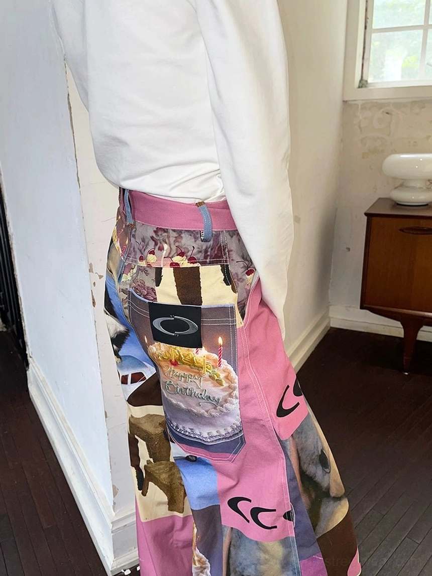 Close-up back waist detail of pink cat birthday cake patchwork print high-waist wide-leg pants
