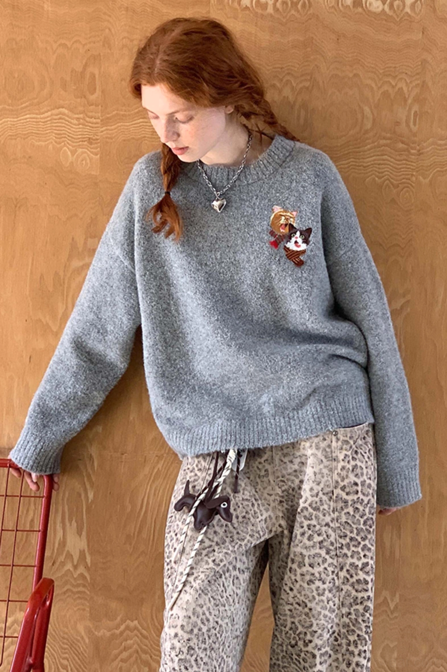 Cat embroidered knit sweater product image showing relaxed Korean streetwear crewneck styling