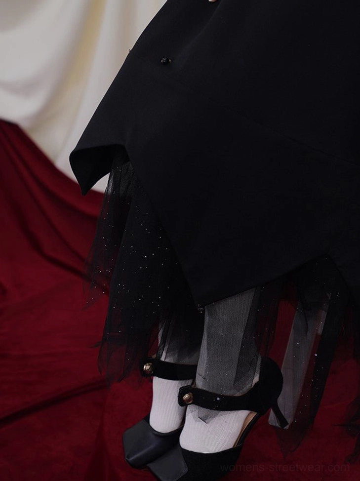 Celestial black embroidered camisole maxi dress with golden sun motifs and flowing asymmetric hem