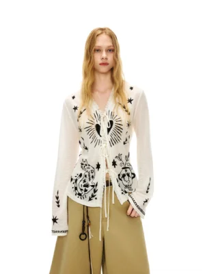Moonlight White celestial cat tie-front knit cardigan front full body view styled with khaki wide-leg trousers