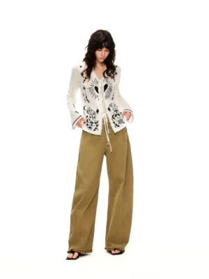 Moonlight White celestial graphic tie-front cardigan front studio outfit with tan wide-leg pants and black sandals