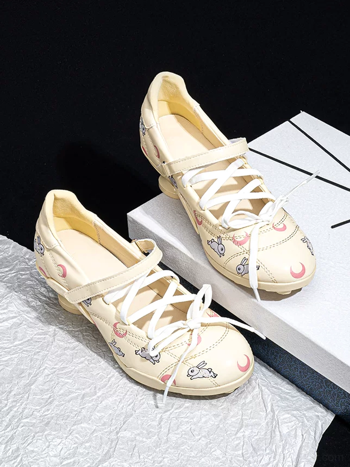 Celestial moon star low-heel sport Mary Janes adjustable strap and lace-up closure detail