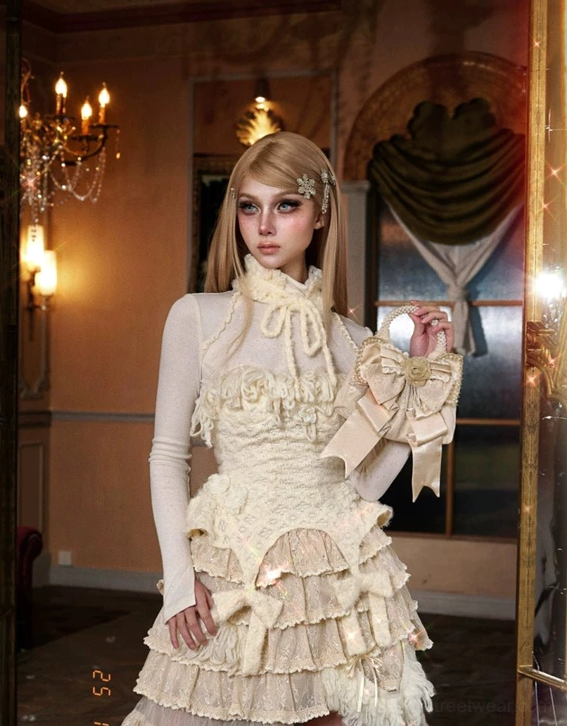 Champagne pearl handle rosette bow mini handbag paired with high-neck ruffled lace gown