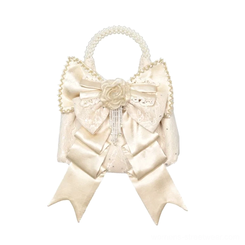 Champagne pearl handle rosette bow mini handbag main product view with oversized bow front