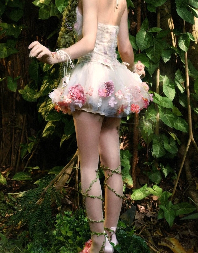 Back view of champagne pink floral tulle petticoat featuring layered sheer tulle and dimensional pink rose decorations