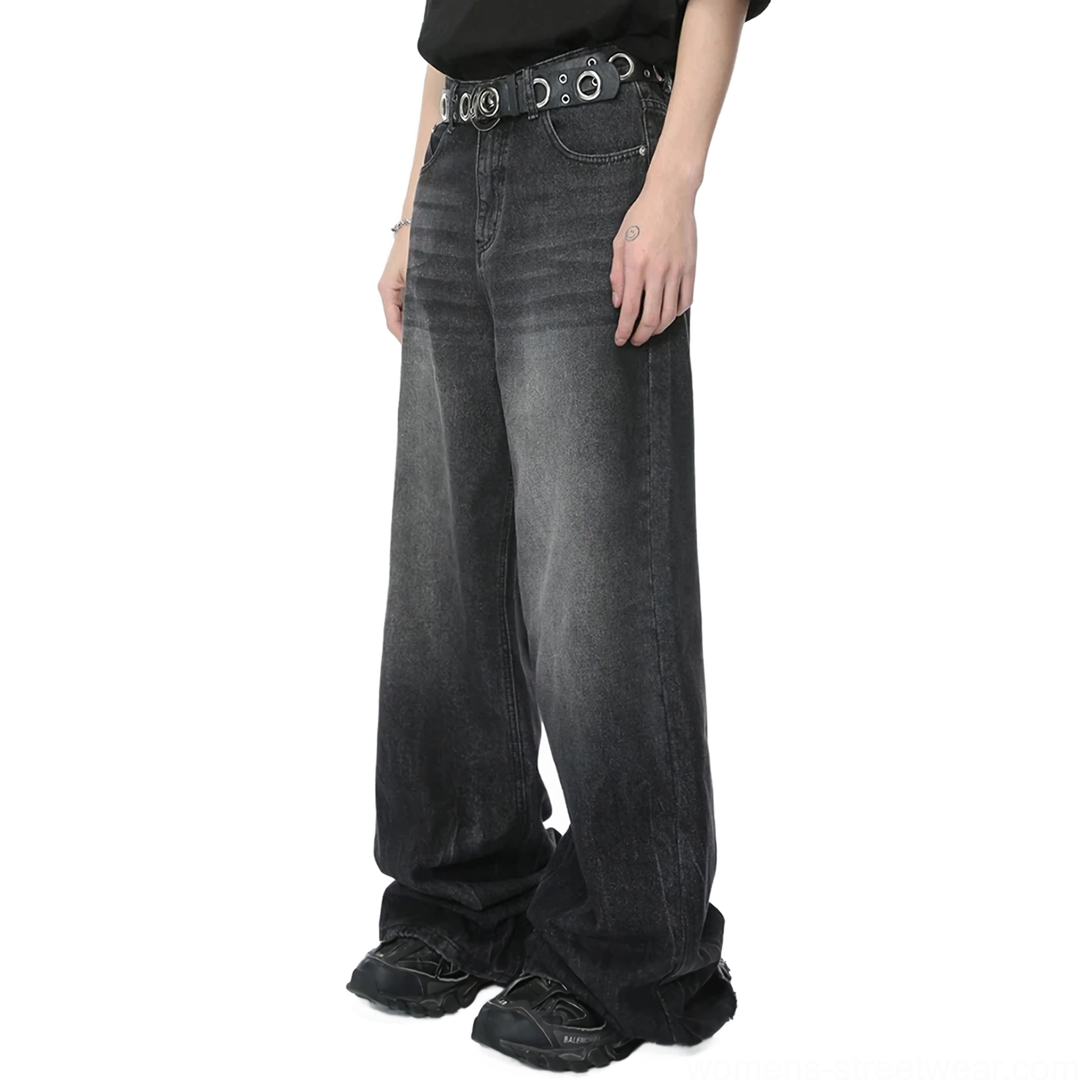 Front view of charcoal faded wide-leg jeans with thigh wash detail, loose draped legs, grommet belt, and black streetwear styling