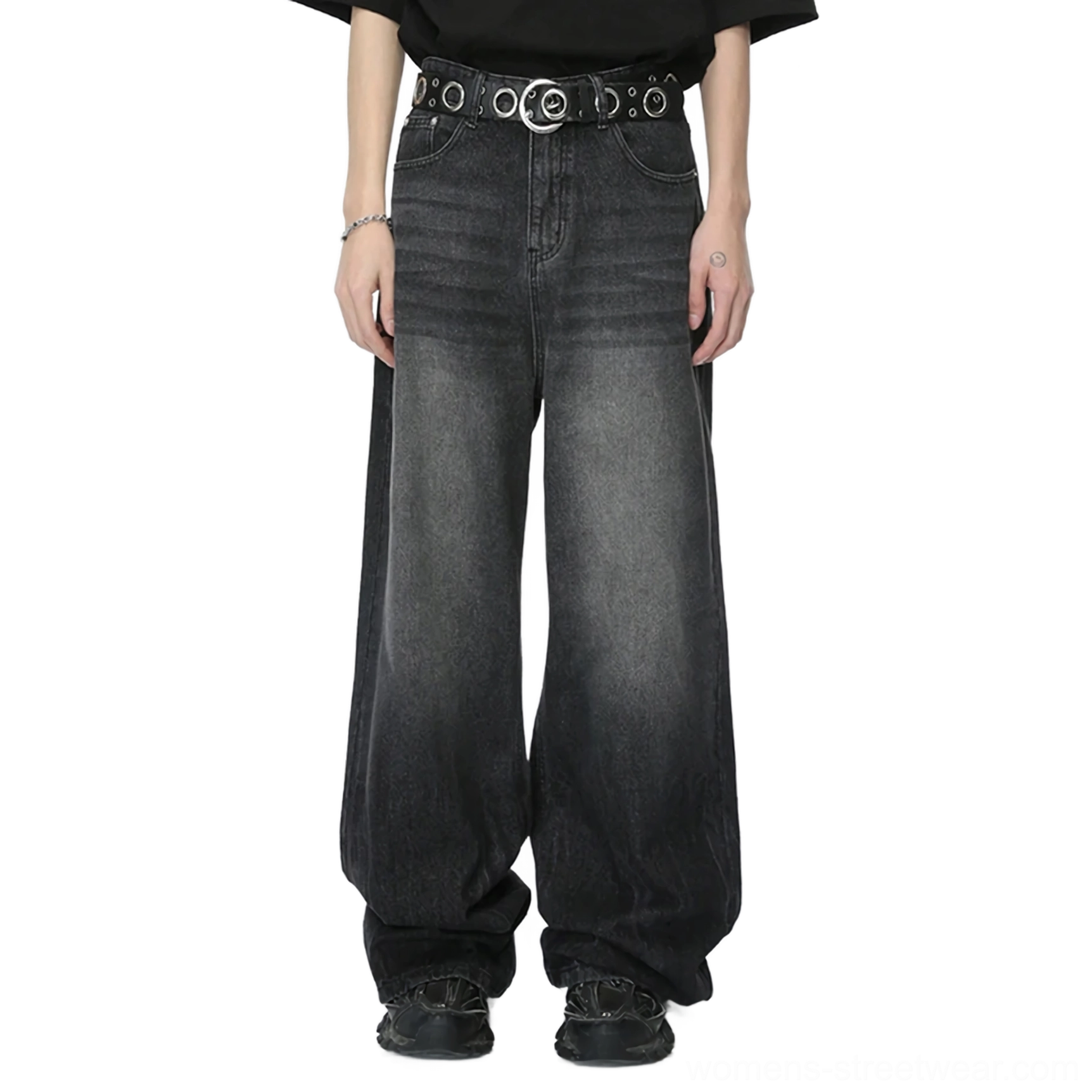 Model wearing charcoal fade wide-leg jeans with a black T-shirt, grommet belt, and black sneakers in a streetwear outfit