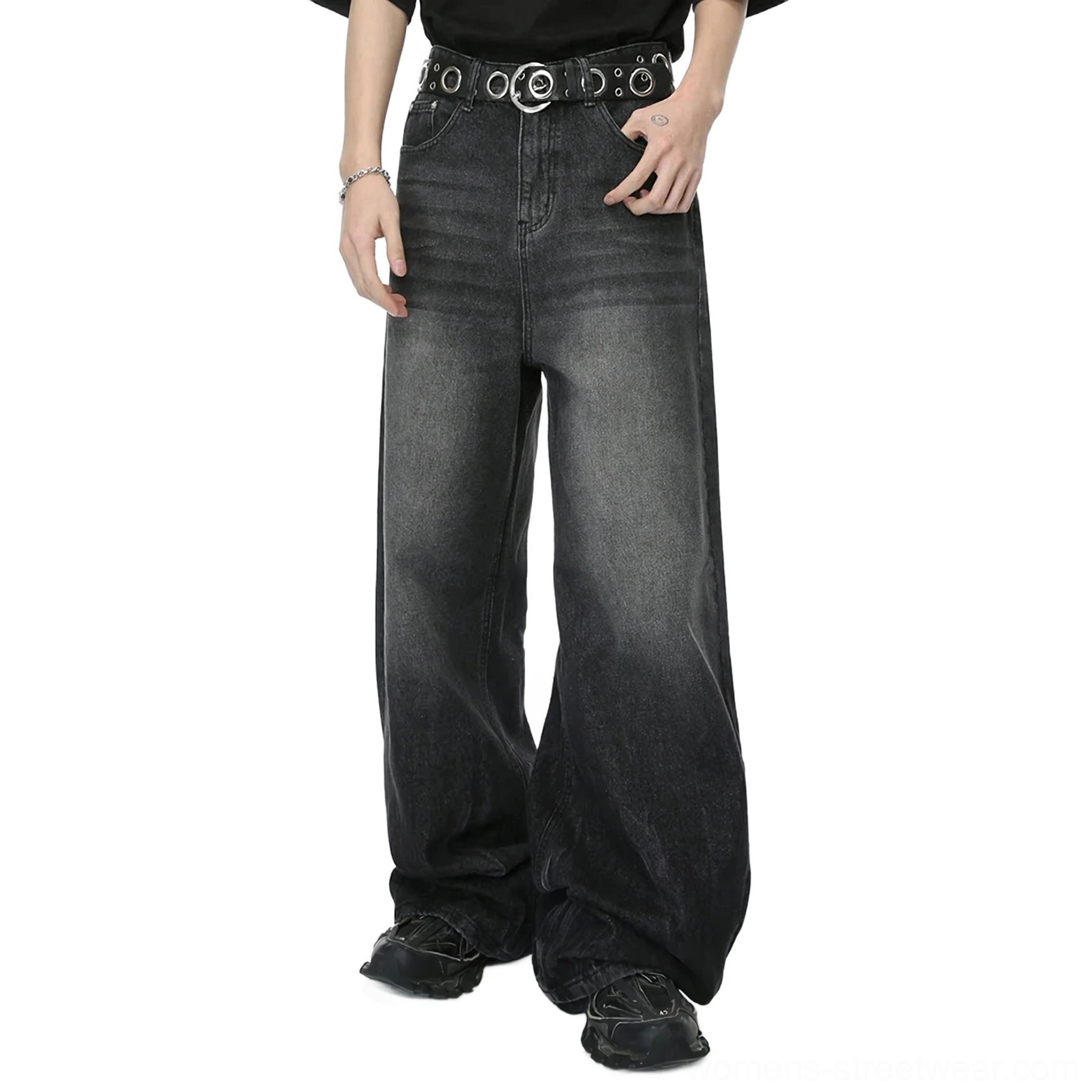 Side view of washed charcoal wide-leg denim jeans styled with a black T-shirt, silver bracelet, grommet belt, and casual shoes