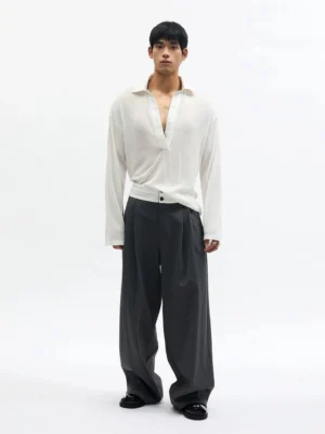 Charcoal dark gray high-rise pleated wide-leg streetwear trousers with ivory waistband shown on a male model