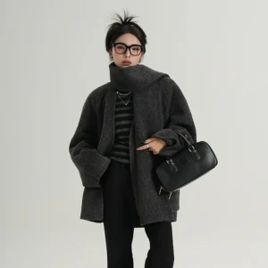 Charcoal gray oversized wool jacket with integrated scarf collar styled as a turtleneck, Korean fashion commuter outfit with black handbag