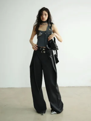 Full-body view of a charcoal gray structured halter-inspired corset bustier top with metallic embellishments and wide-leg streetwear pants