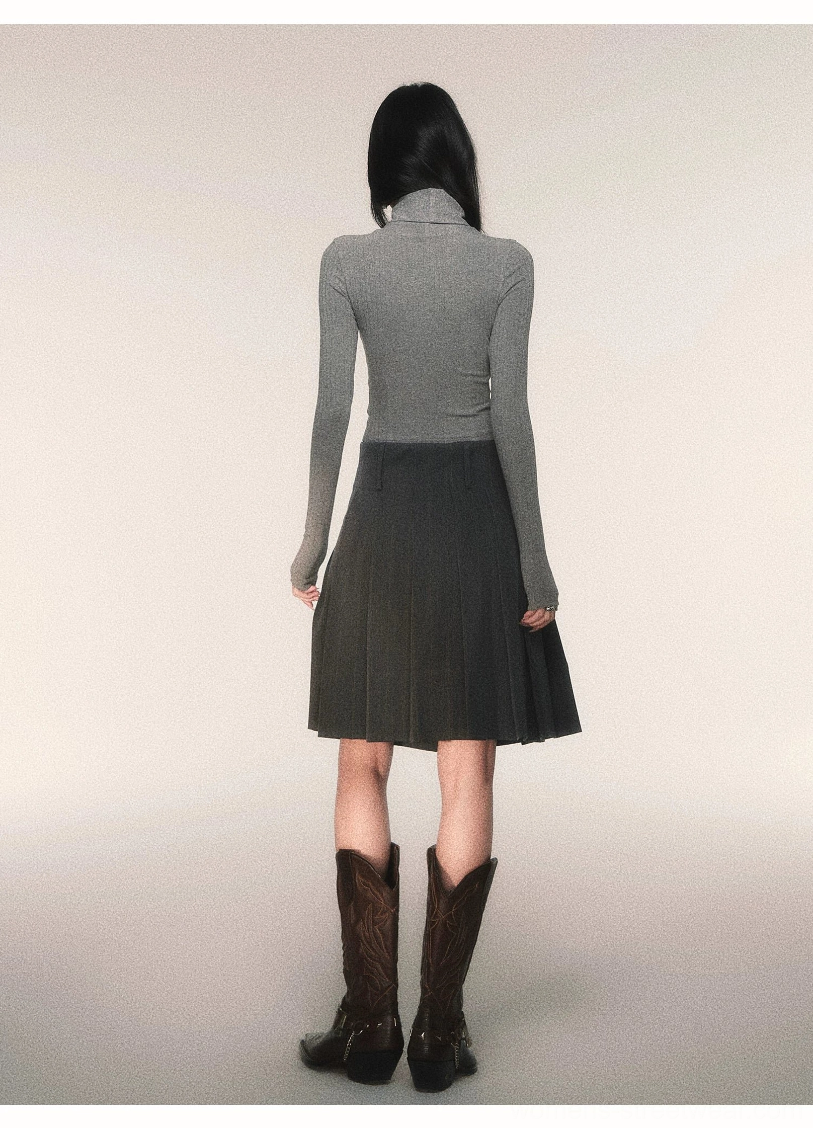 Back view of charcoal pinstripe pleated midi skirt showing structured pleats detachable black belt and midi length