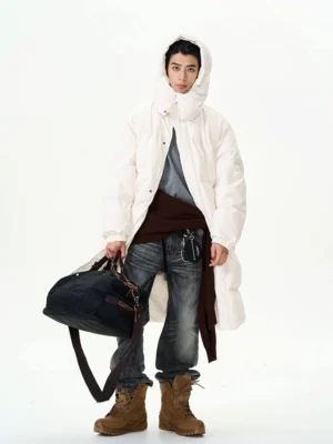 Front view of charcoal washed straight leg jeans styled in a relaxed streetwear outfit with vintage faded denim texture