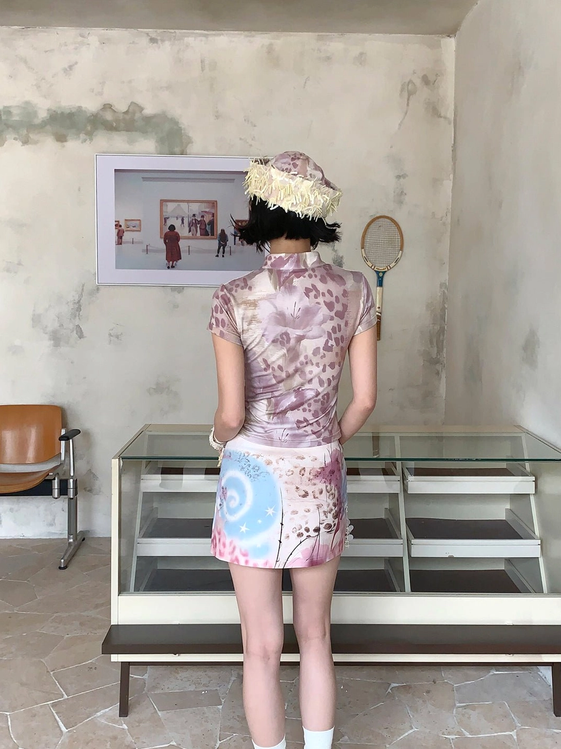 Back view of a fitted multicolor cheongsam collar tee showing the full coverage graphic print and slim waist silhouette