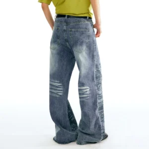 Back view of washed indigo Chinese calligraphy wave print straight-leg jeans with distressed knee details