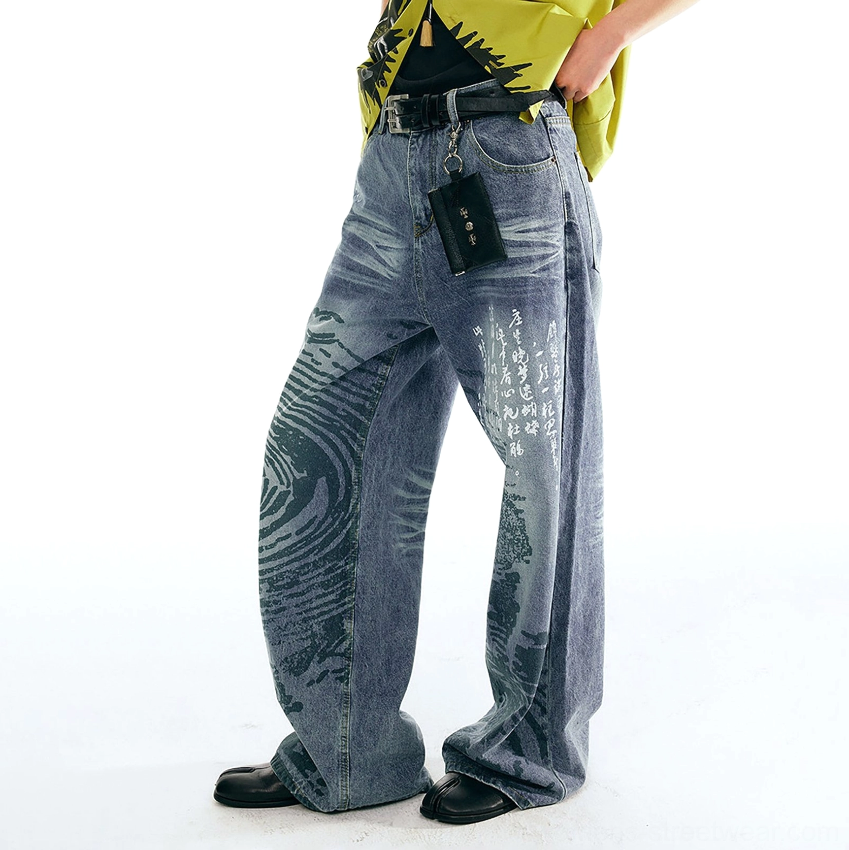 Side three-quarter view of wide straight-leg jeans with Chinese character print wave texture and hanging waist strap
