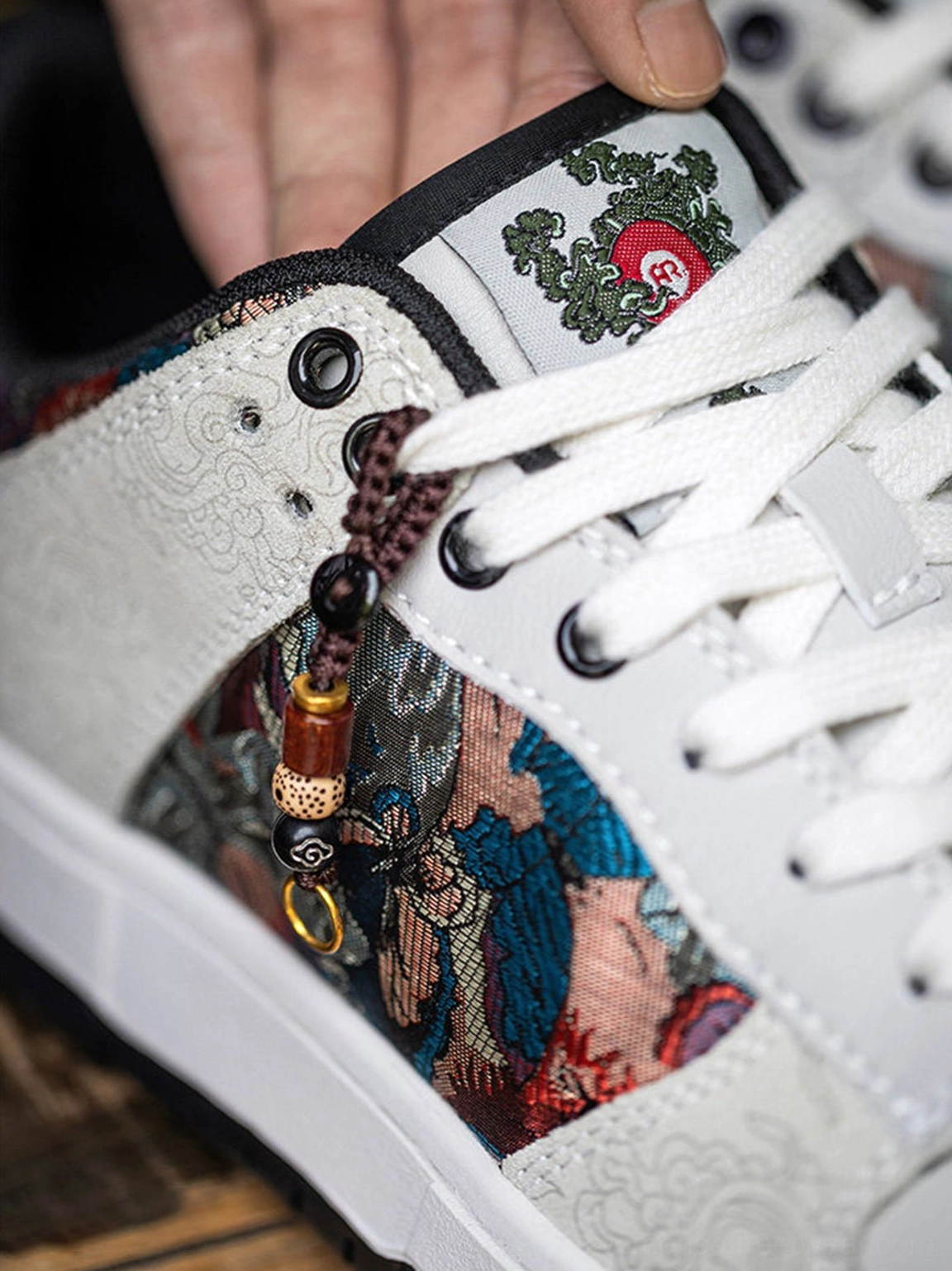 Chinese embroidered bird brocade streetwear court sneakers with lace-up closure, padded collar, and flat rubber sole
