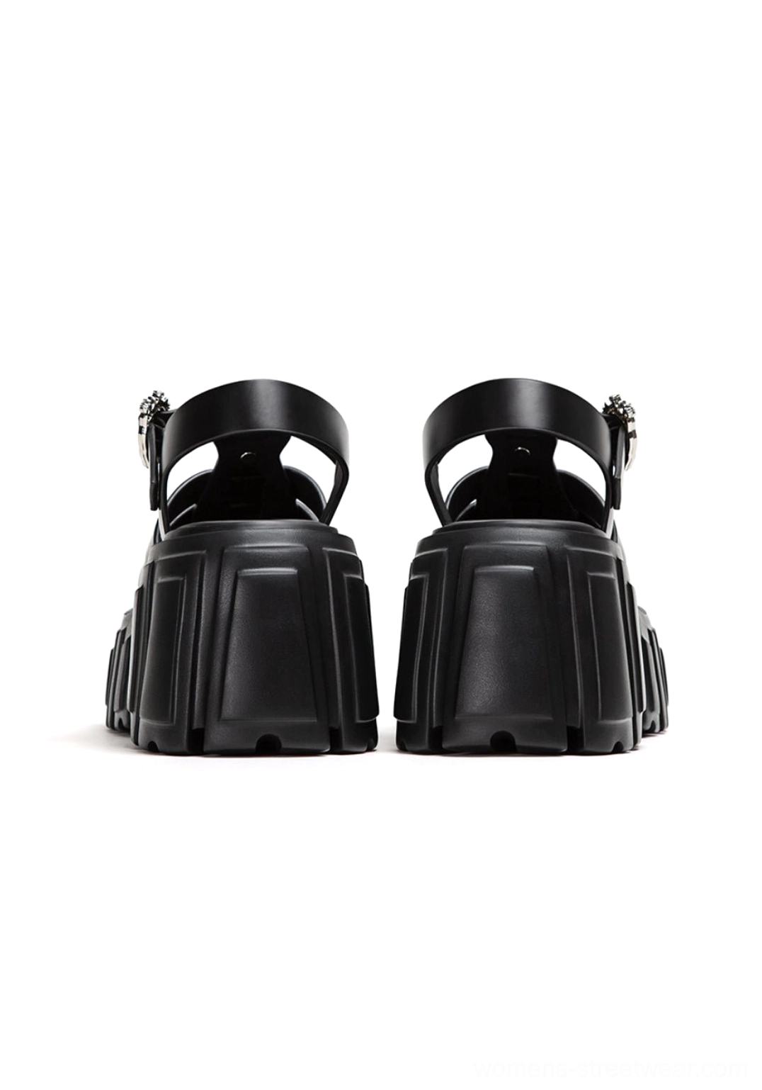 Chunky black Roman sandals with elevated block heel, adjustable ankle fastening, and avant-garde streetwear silhouette