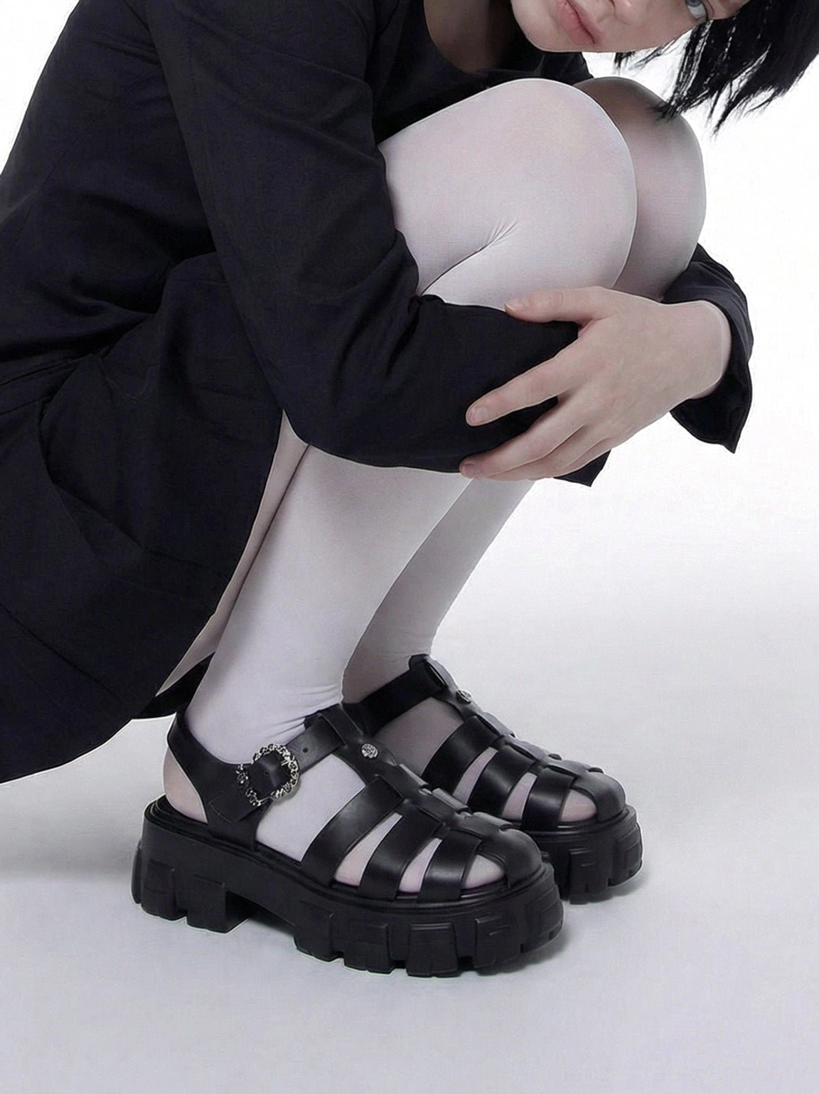Chunky fisherman sandals with elevated platform sole, adjustable ankle strap, and contemporary utility-inspired styling
