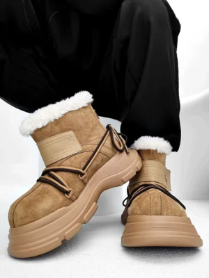 Side three-quarter view of chestnut suede-finish platform shearling snow boot with hiking laces and thick rubber sole