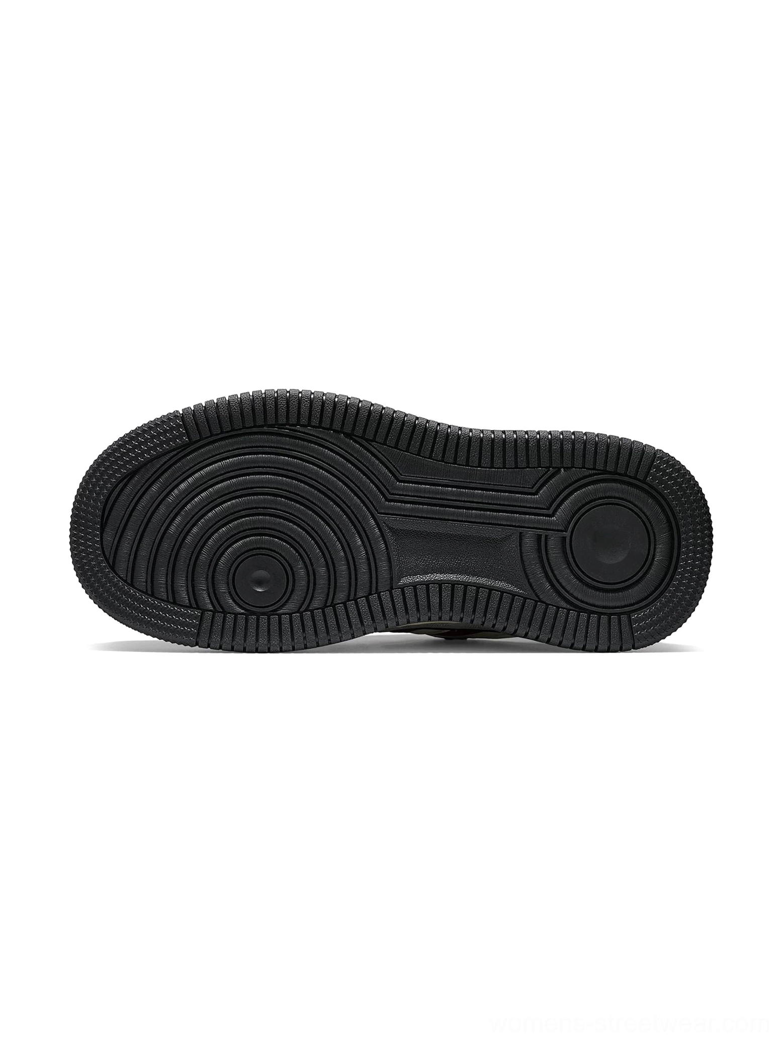 Black rubber outsole with circular multi-directional traction pattern for chunky platform streetwear sneakers