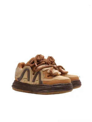 Chunky caramel brown and cream rope lace platform sneakers with dark brown color-block panels, oversized laces, dimensional side detailing, and thick streetwear sole