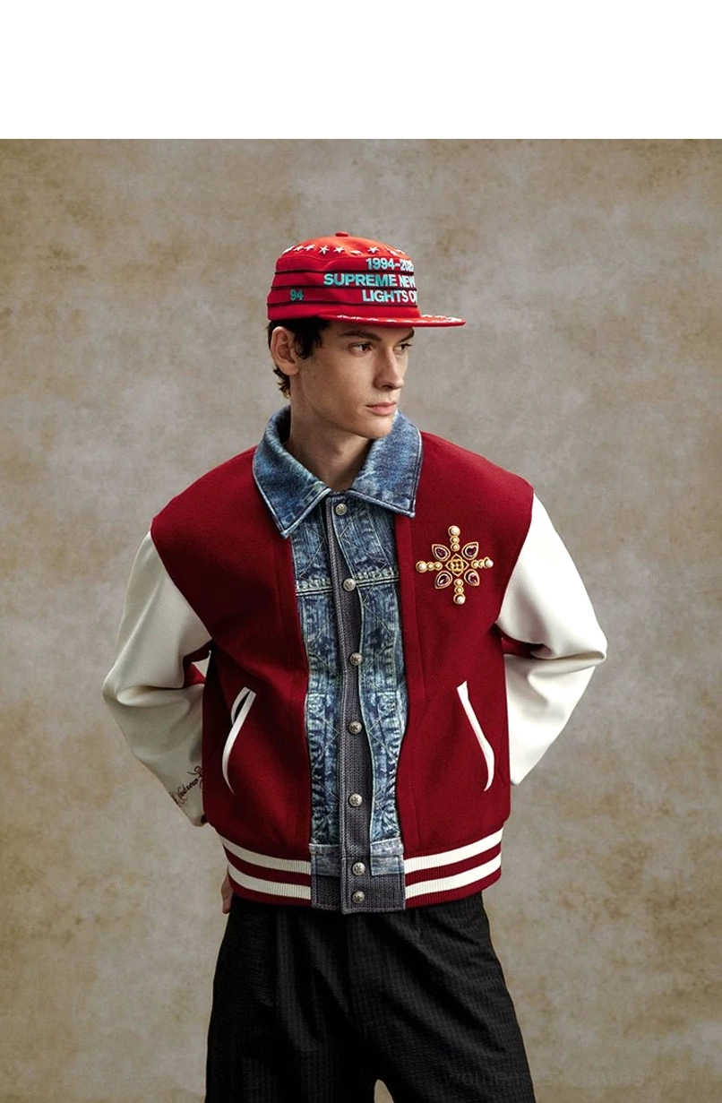 Claret denim panel embroidered varsity bomber jacket with chest motif, side pockets, layered snap placket, striped trims, and retro streetwear styling