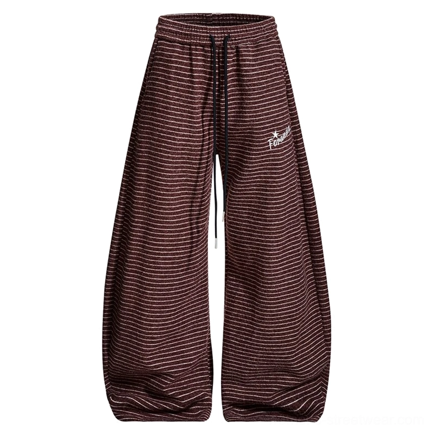 Flat lay of claret striped fleece wide-leg streetwear pants with thin horizontal stripes, drawstring waistband, and subtle embroidered detail