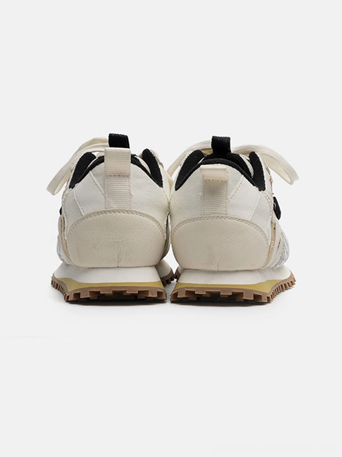 Classic ivory retro running sneakers with black accent details and brown waffle outsole for denim and casual streetwear looks