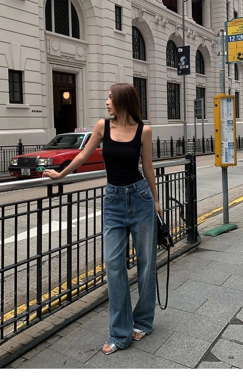 Classic washed blue denim jeans with relaxed wide-leg cut and high waist for women's streetwear outfits