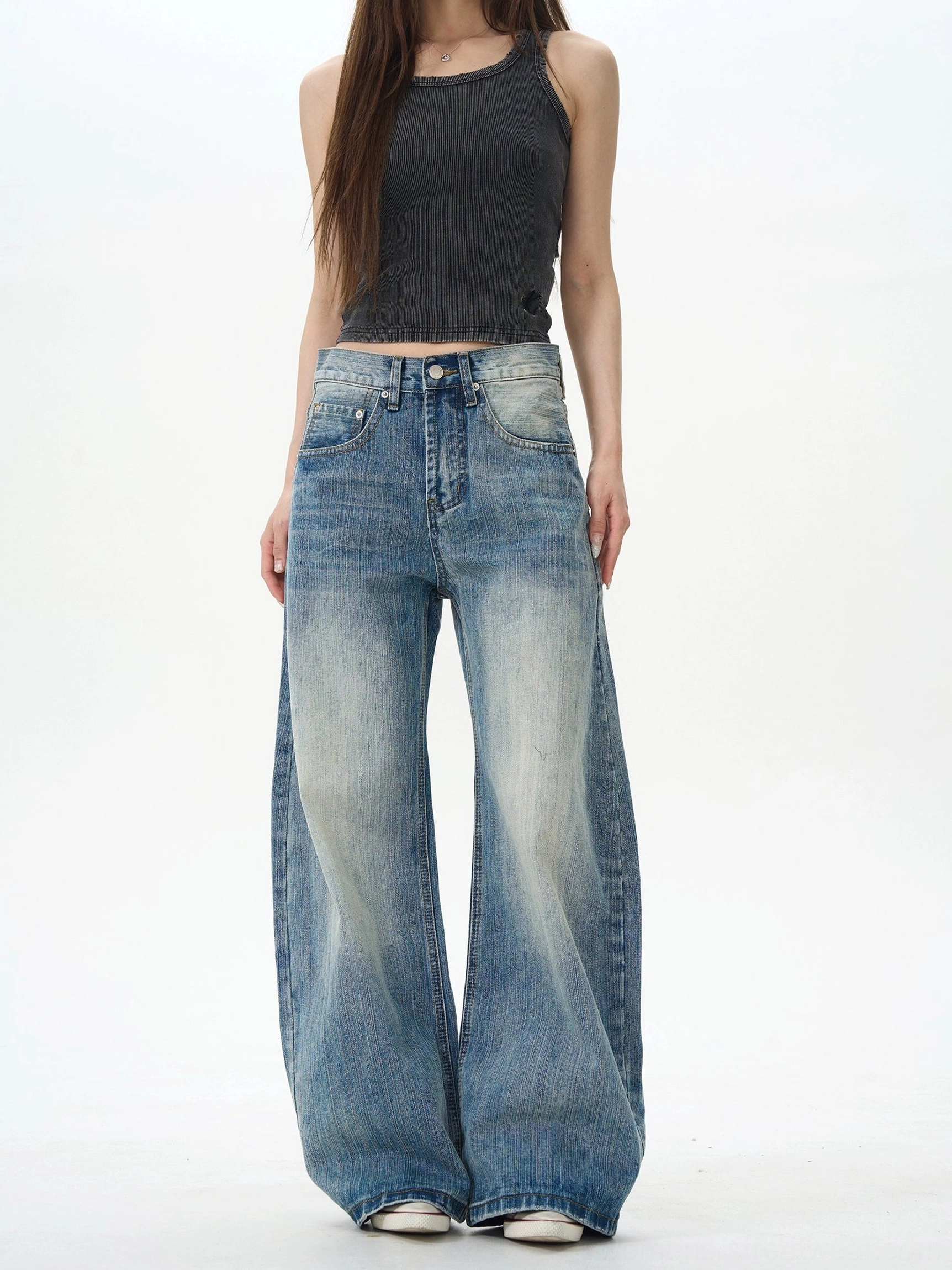 Clean vintage washed blue wide leg denim jeans front view styled with black ribbed tank top