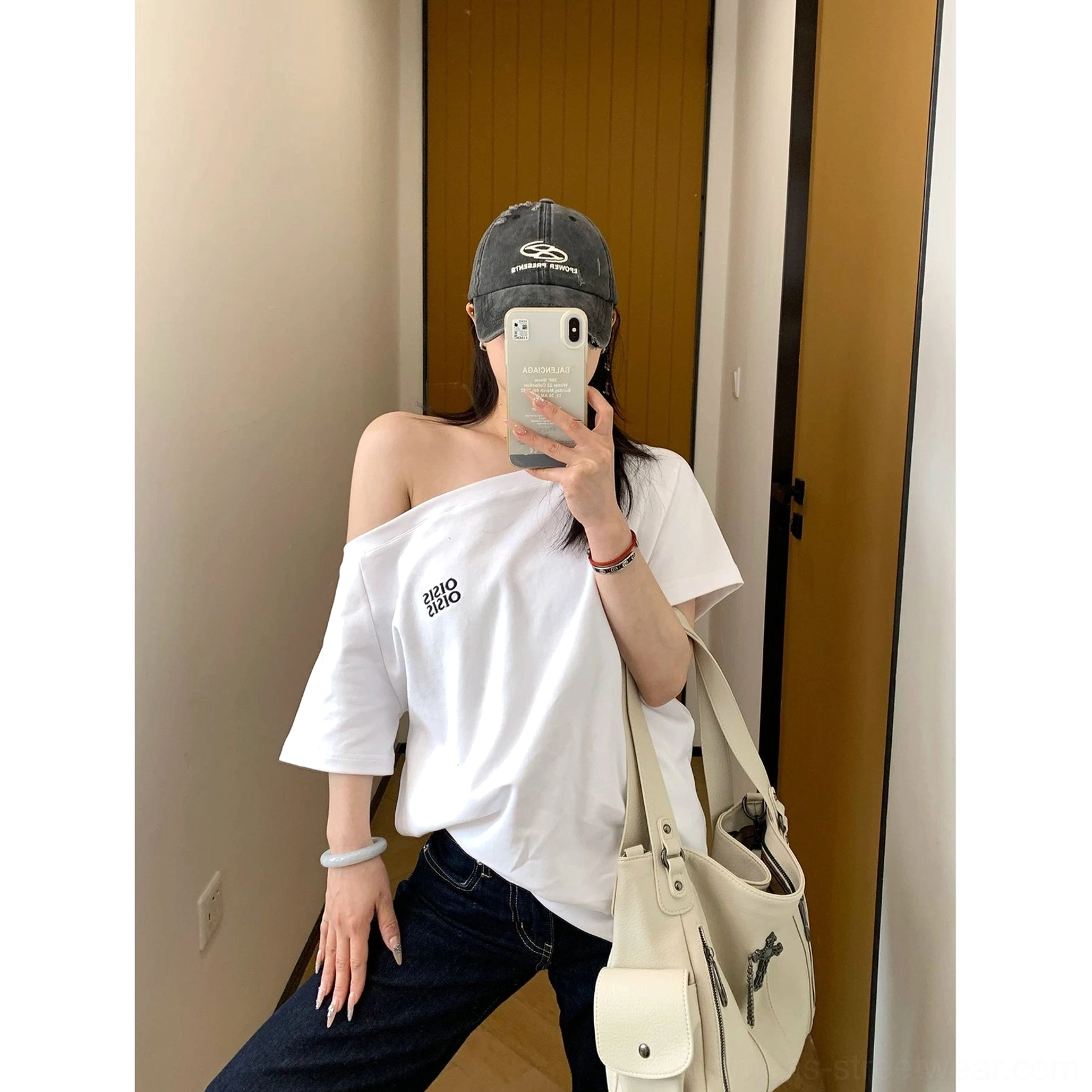 Clean white off-shoulder logo tee with relaxed short sleeves for modern minimalist streetwear and casual layering