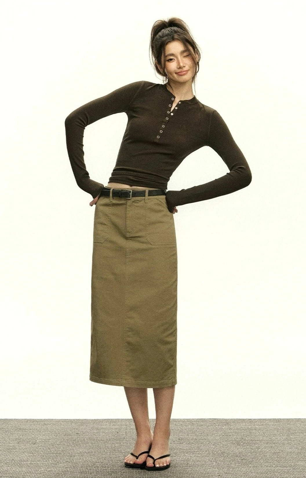 Close-fitting ribbed Henley cropped top with adjustable button neckline and full-length sleeves