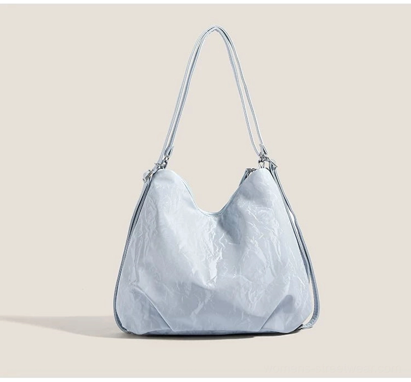 Front view of light blue cloud charm crinkle convertible hobo shoulder bag with dual silver straps