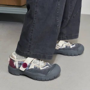 Coconut Gray plaid sport Mary Jane shoes worn with dark wide-leg jeans, featuring contrast cord details, a wine-red heel accent, adjustable hook-and-loop strap, protective rubber toe cap, and chunky treaded streetwear sole