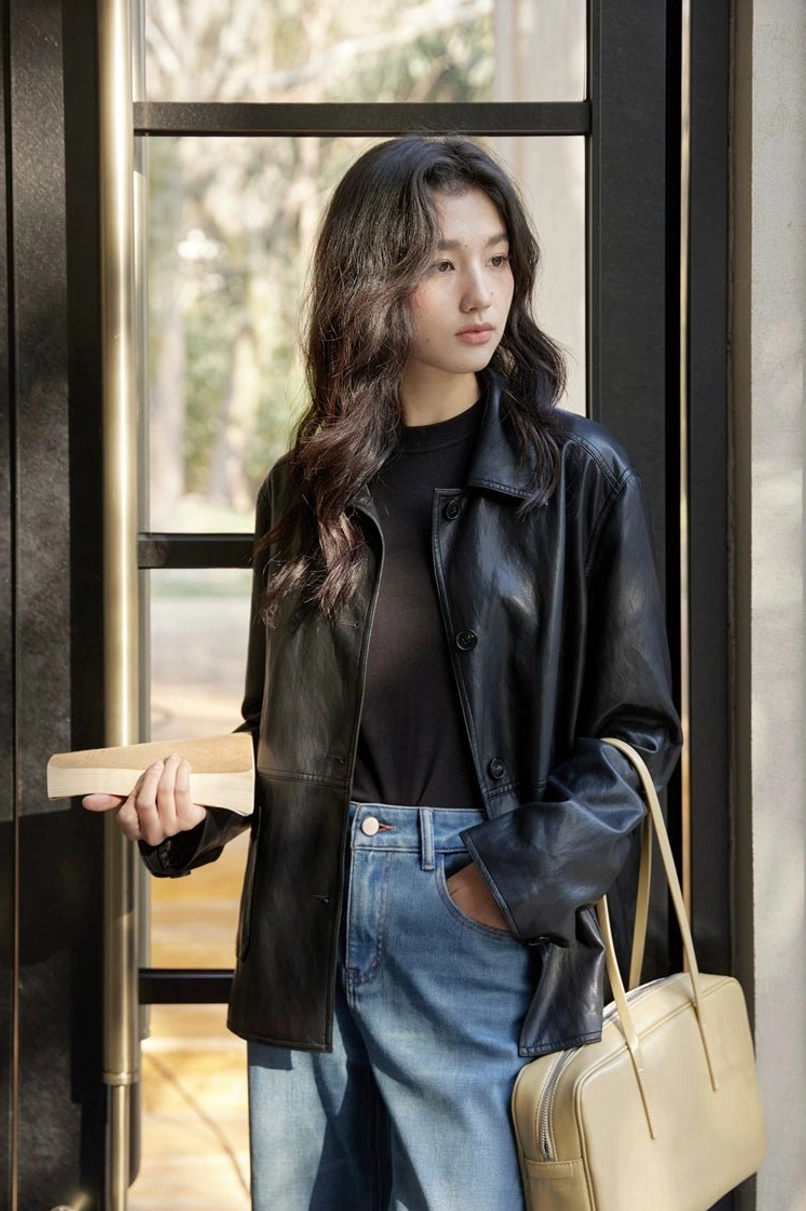 Coffee color or black short leather jacket for women with relaxed fit and classic button closure