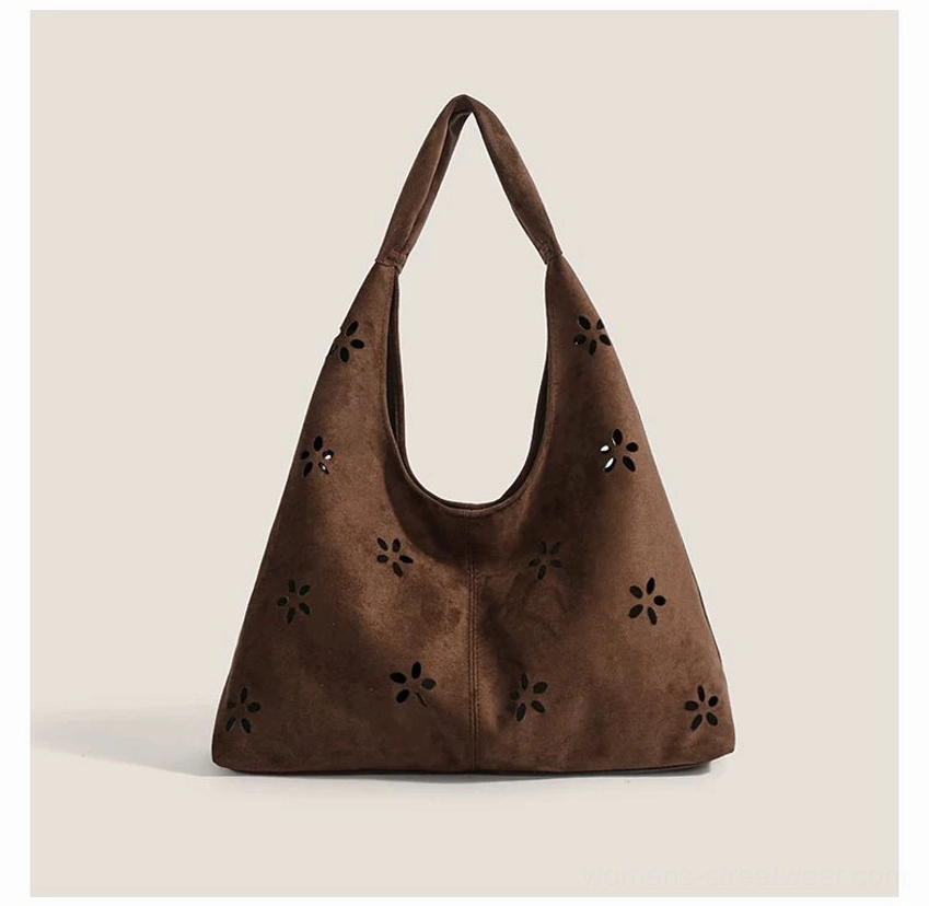 Coffee brown daisy cutout suede-effect hobo tote bag front view with slouchy shoulder silhouette