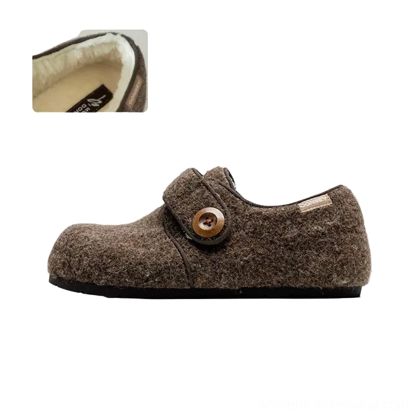 Coffee brown fuzzy Mary Jane slippers shown from the side with plush fleece upper, retro button strap, closed toe, and supportive thick sole