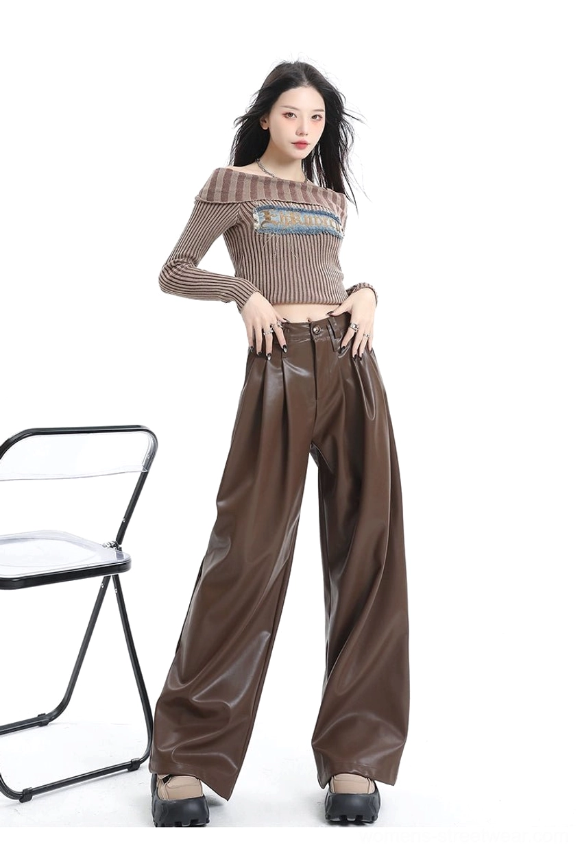 Front view of coffee brown glossy PU leather wide-leg pants styled with cropped knit top platform shoes and shoulder bag