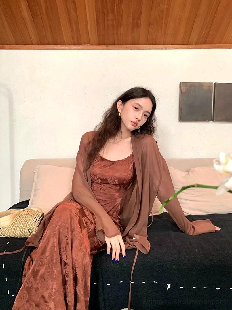 Coffee brown floral jacquard satin slip dress with sheer cardigan styled in a vintage sofa interior