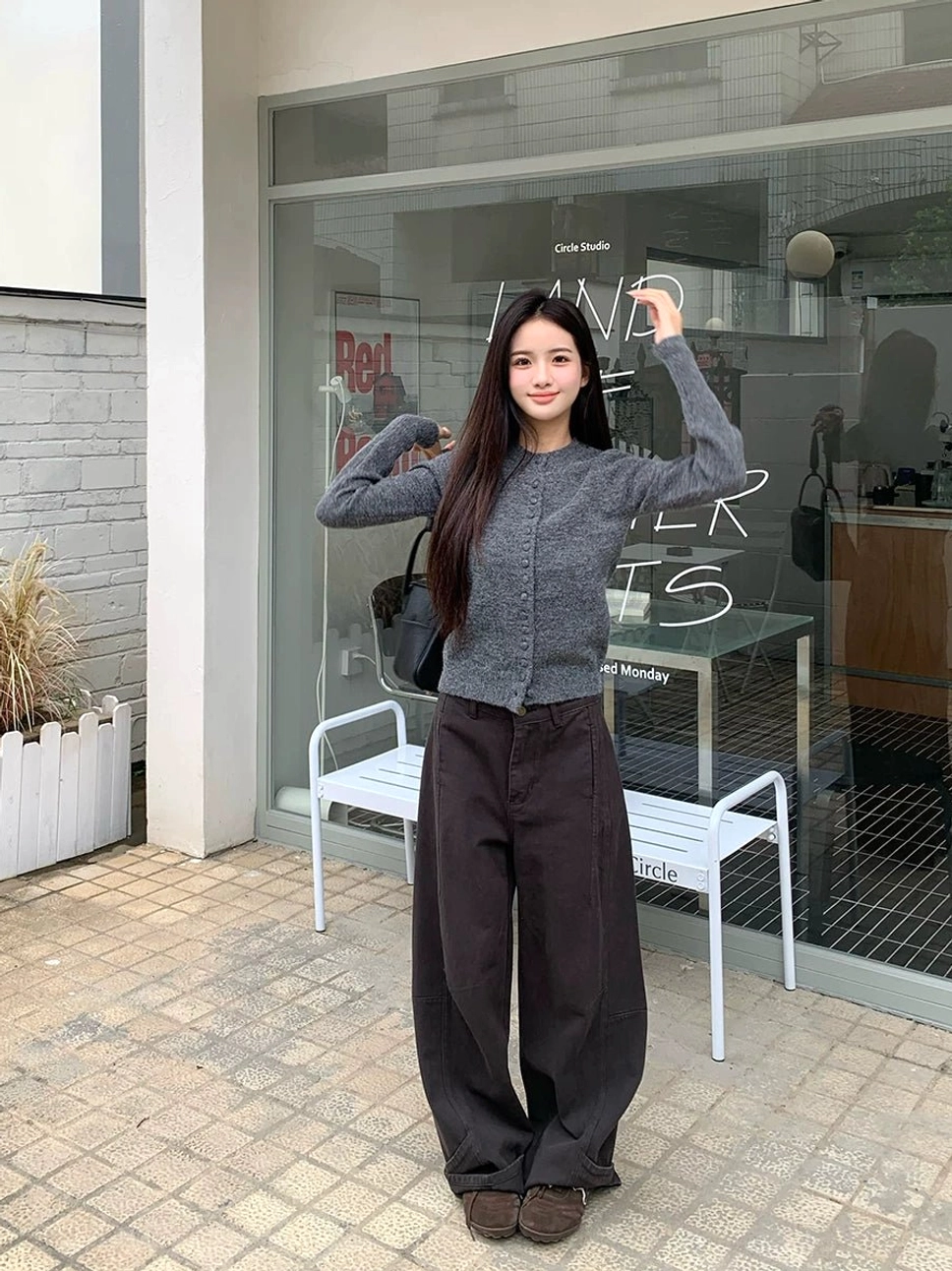 Coffee brown panel-seam wide-leg jeans shown in a full-body streetwear look with a relaxed floor-length silhouette